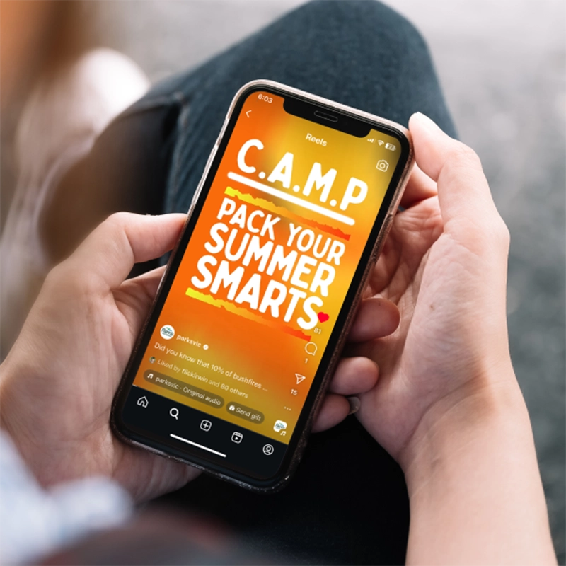 Pack Your Summer Smarts campaign artwork displayed on a mobile phone.
